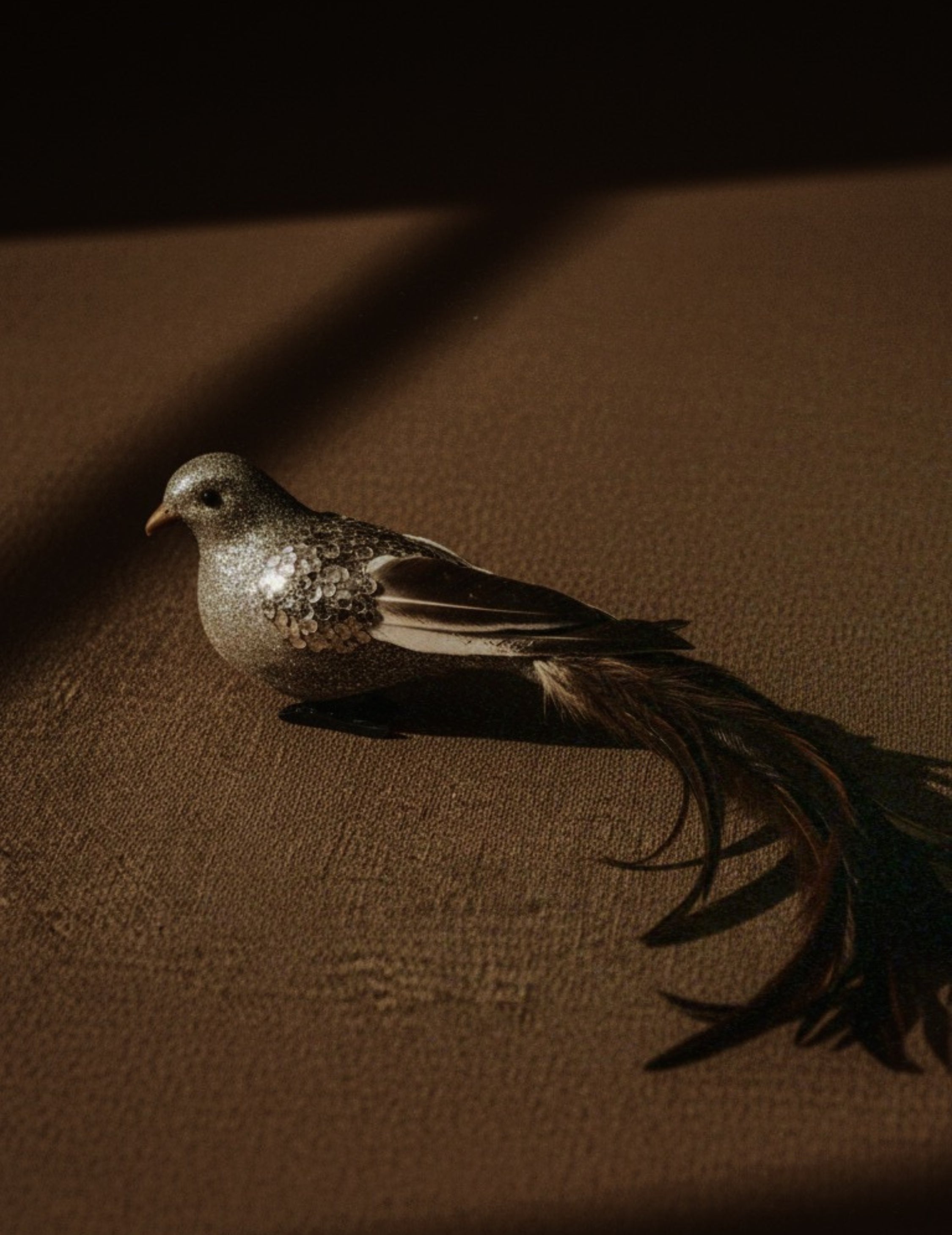 Christmas ornament bird with feathers champagne